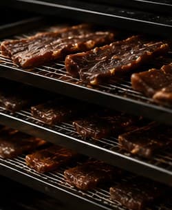 Jerky drying on racks